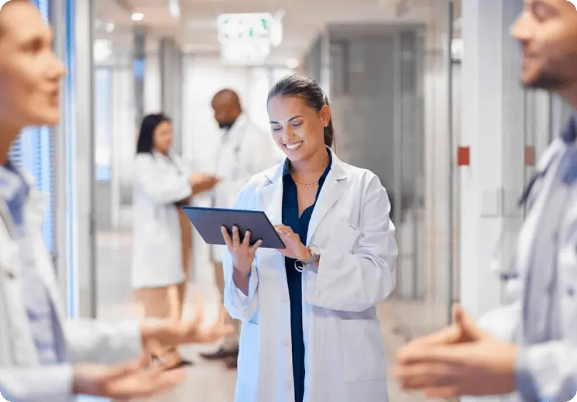 Doctor reviewing campaign information in a clinic corridor