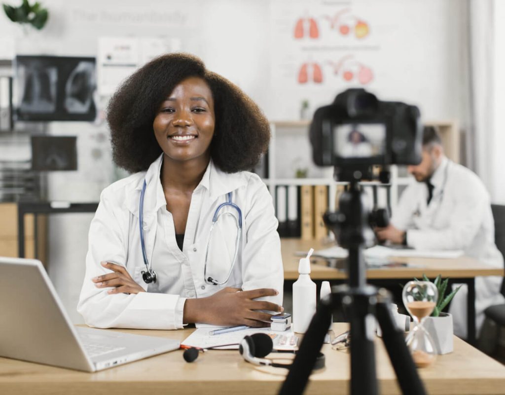Doctor recording a social media video in a clinic